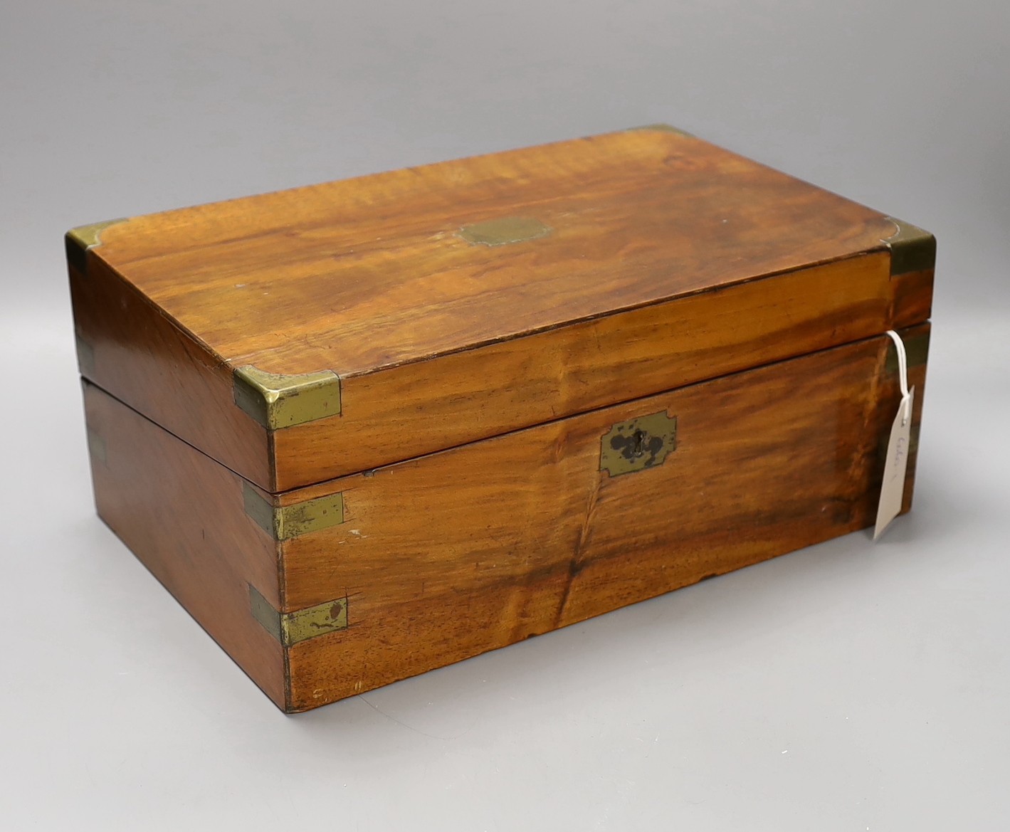 A small early 20th century brass bound mahogany writing slope, 35cm